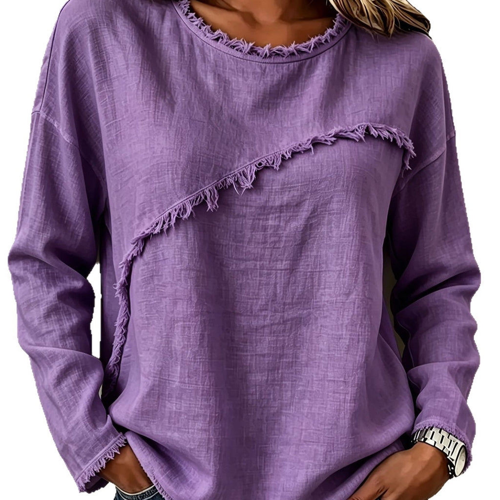 Purple sweater with frayed edges worn by a person on a white background