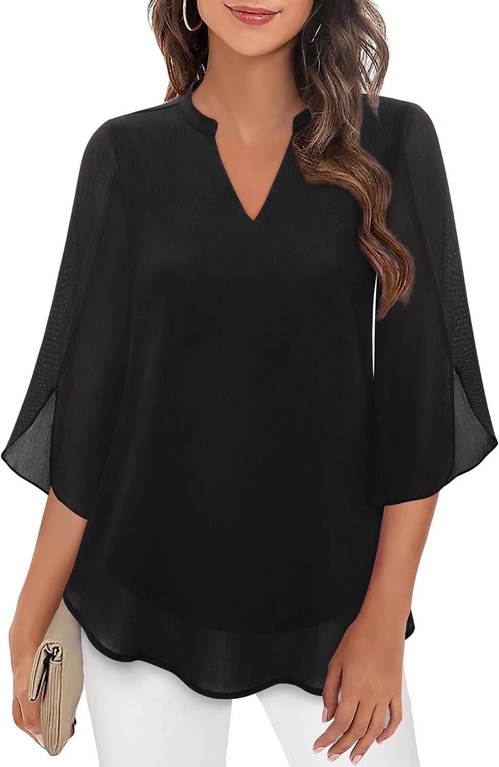 Black blouse with sheer sleeves worn by a model on a white background