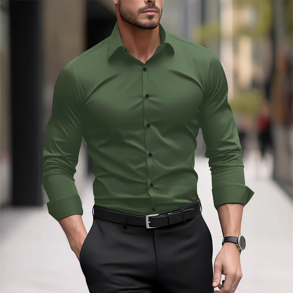 Man wearing a green dress shirt and black pants in an urban setting