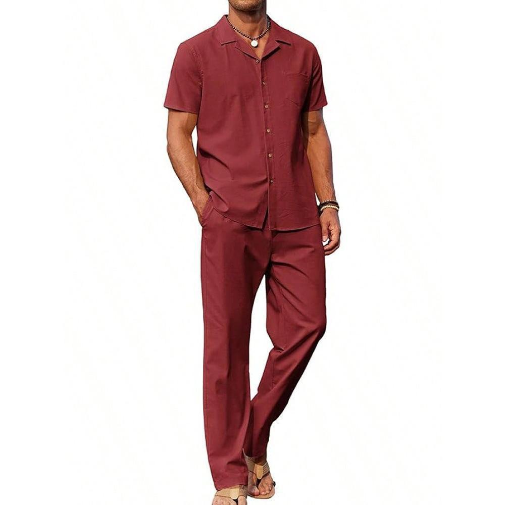 Man wearing a maroon shirt and pants on a white background