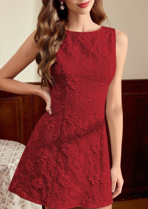 Red lace dress worn by a model indoors