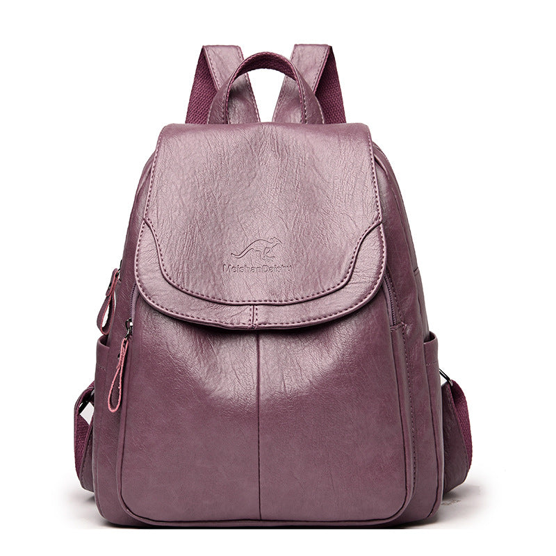 Purple backpack with a visible brand logo on a white background