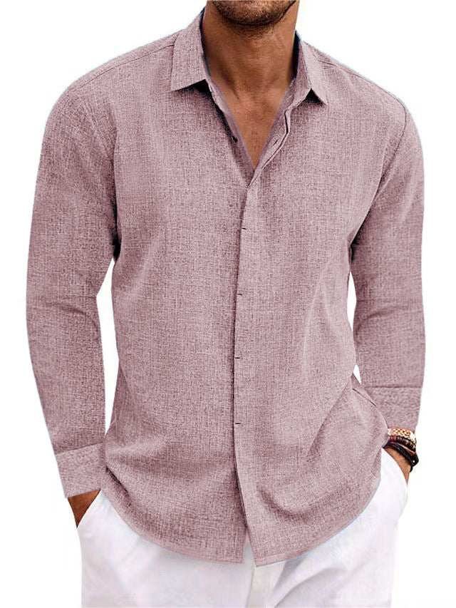 Man wearing a mauve button-up shirt with white pants on a white background