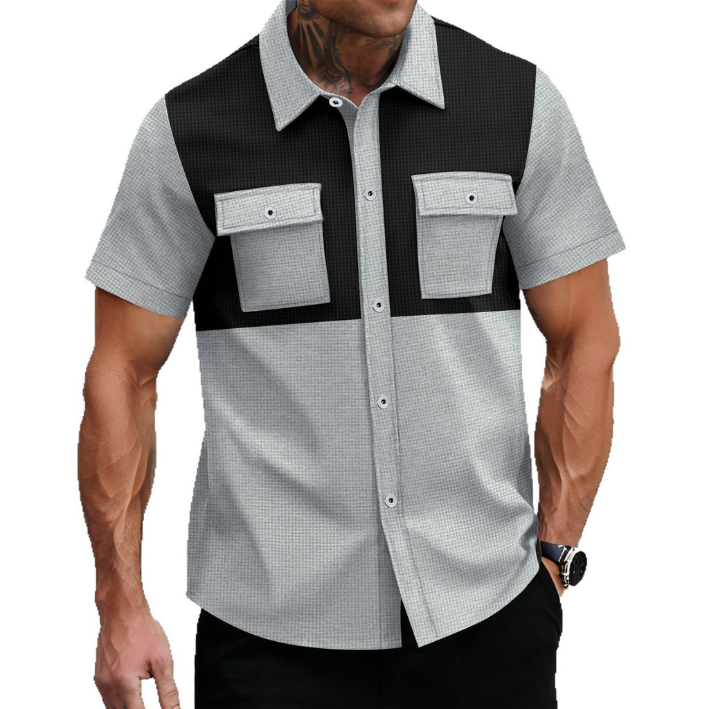 Man wearing a black and gray checkered shirt with a vest on a white background