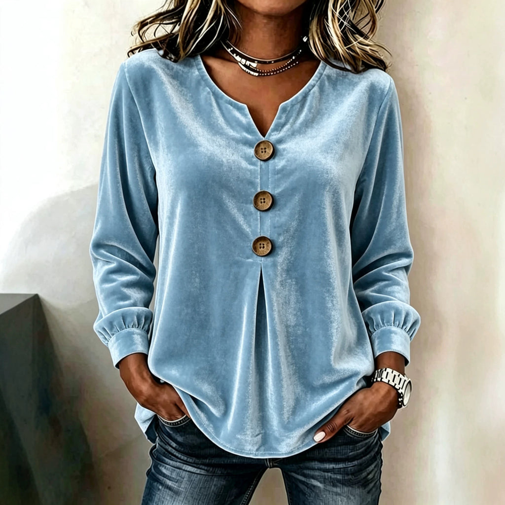Light blue button-up shirt worn by a person against a neutral background