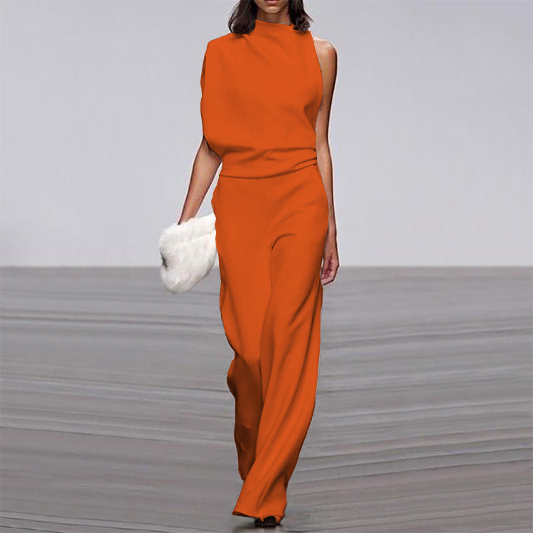 Person wearing an orange jumpsuit on a plain background