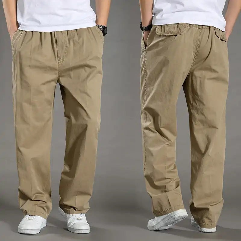Beige pants worn by a person on a gray background