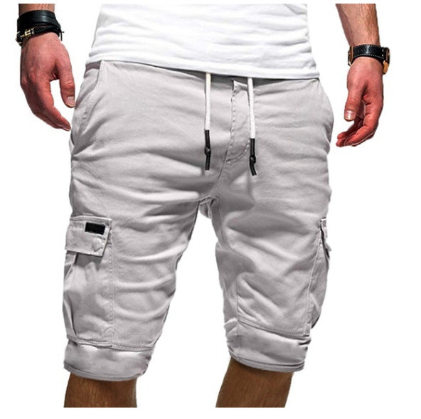 Light gray cargo shorts worn by a person on a white background
