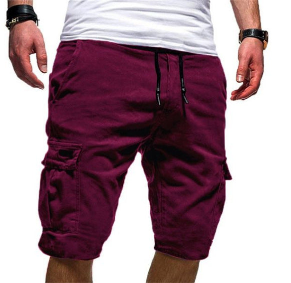Maroon cargo shorts worn by a person on a white background