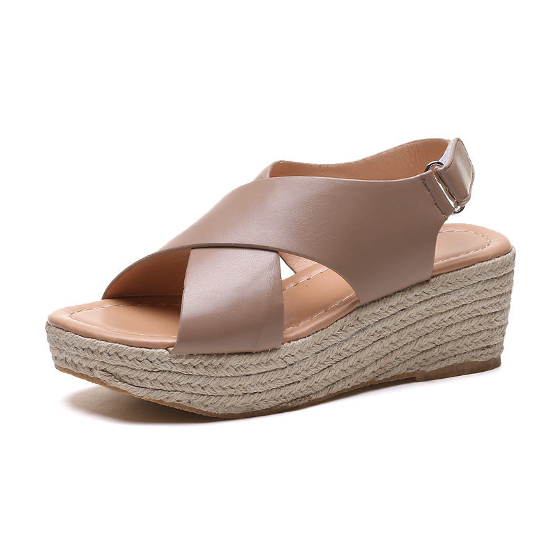 Beige wedge sandal with espadrille sole on a white background