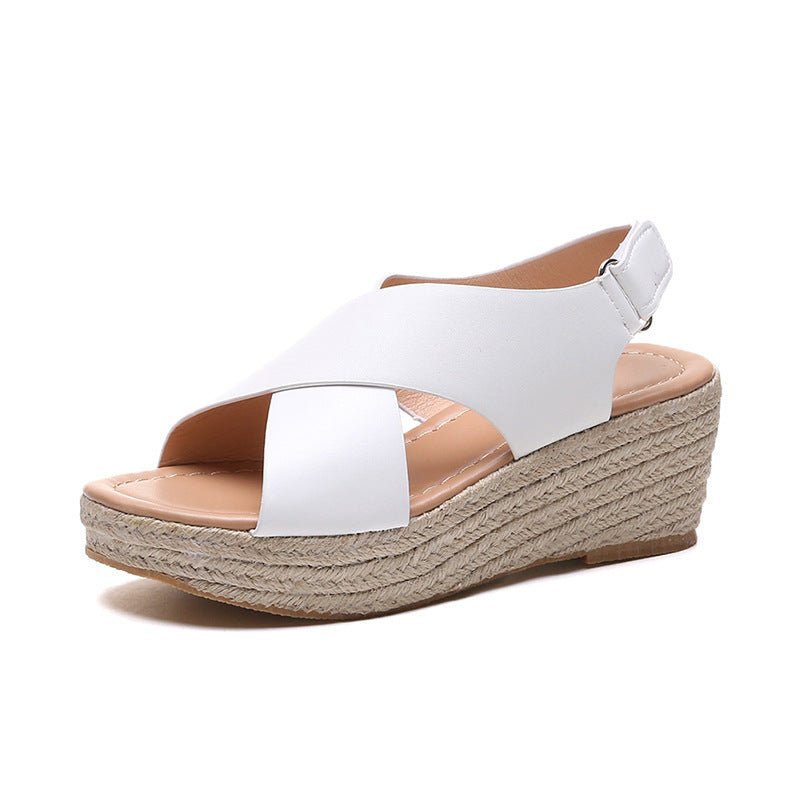 White wedge sandal with espadrille sole on a white background