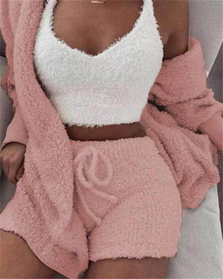 Woman wearing cozy pink loungewear set and fuzzy white crop top on sofa, ZA-Zola fashion