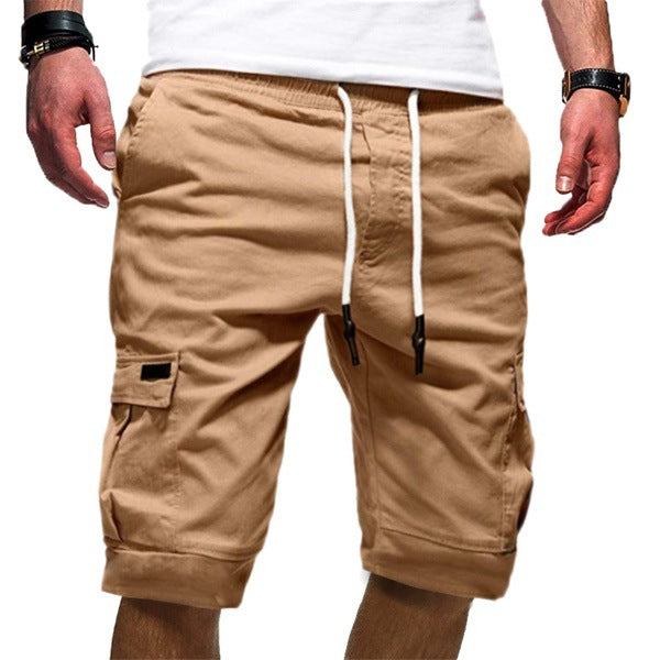 Beige cargo shorts with white drawstrings on a white background