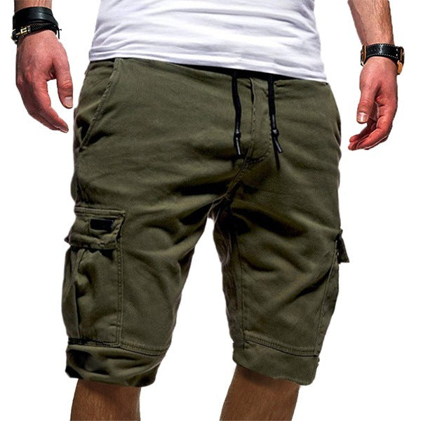 Green cargo shorts worn by a person on a white background