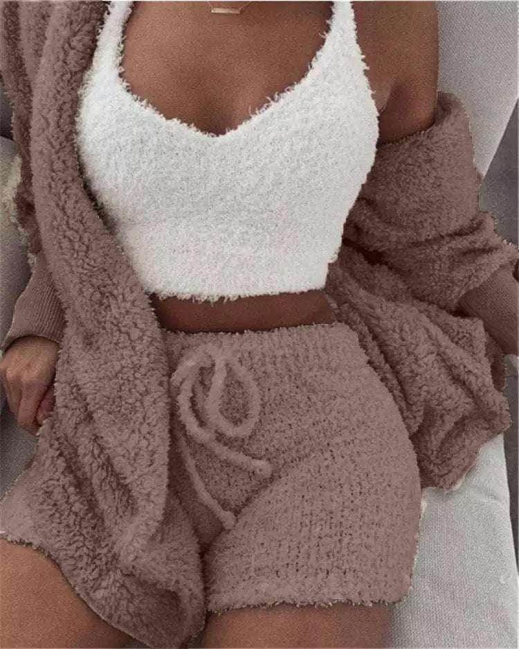 Woman wearing cozy knit loungewear set in pink and white from ZA-Zola fashion UK
