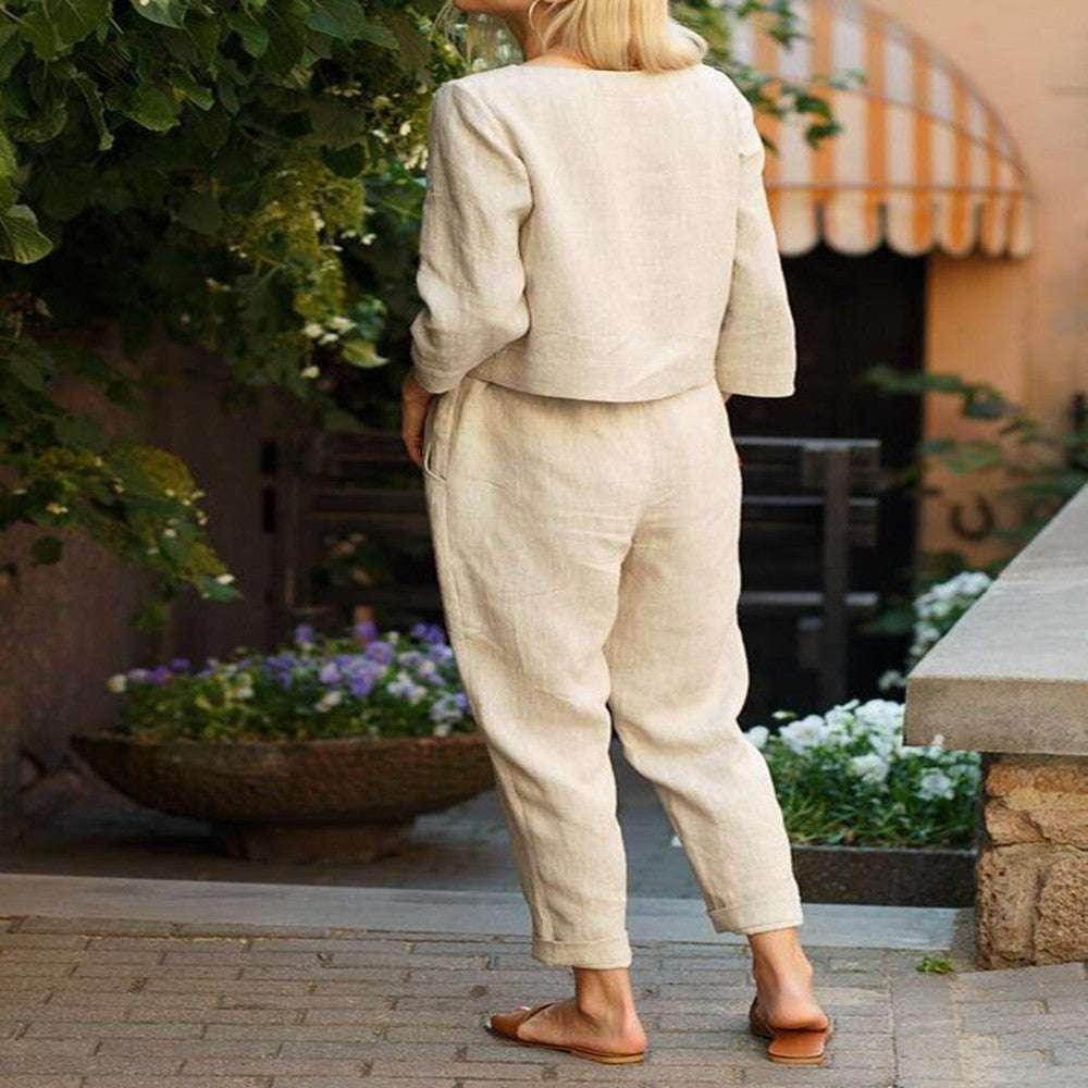 Woman wearing a beige linen pantsuit and sandals, outdoors, ZA-Zola fashion style