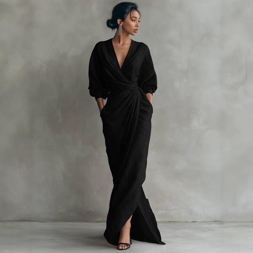 Woman wearing a black dress against a gray background