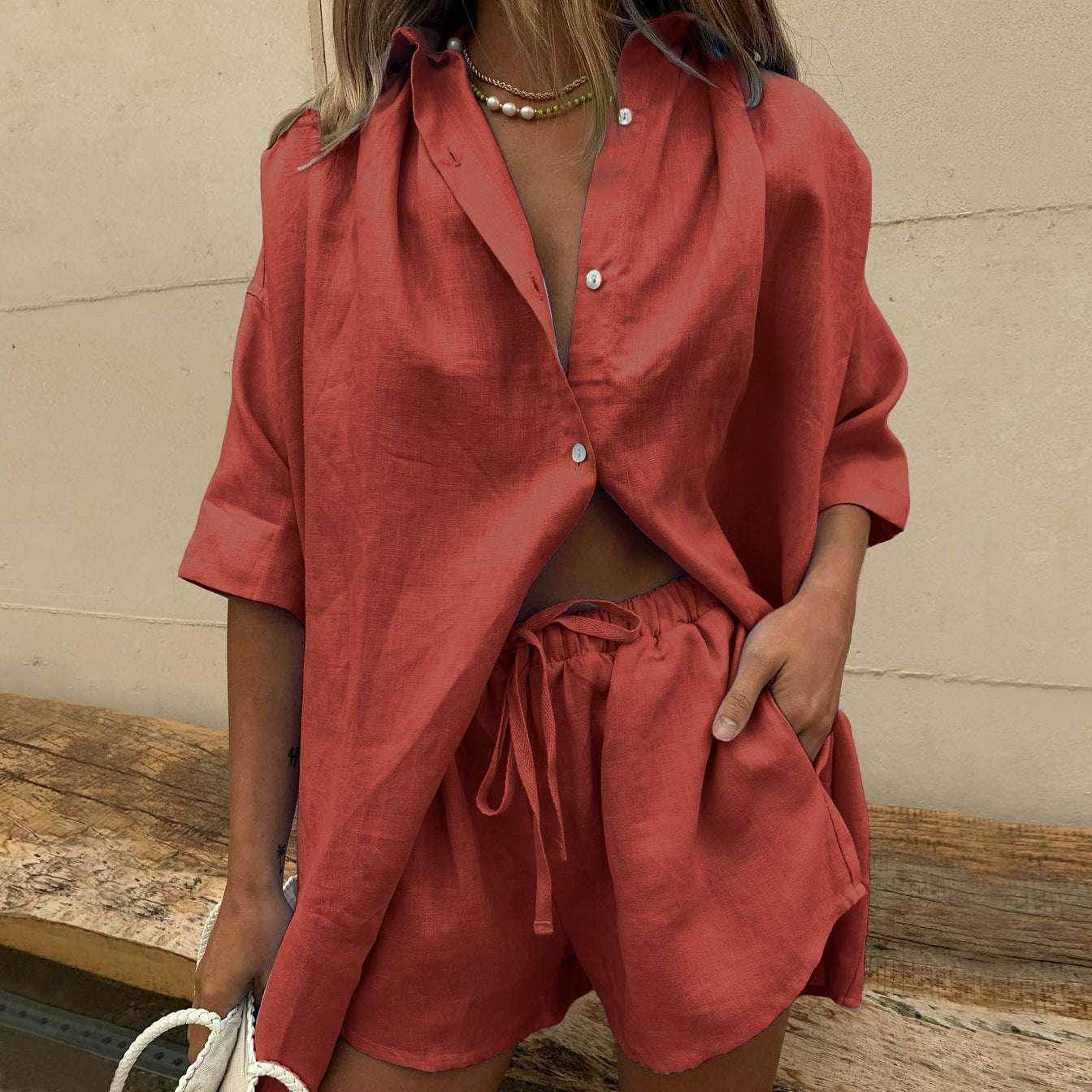 Woman in a trendy rust-red linen shirt and shorts set, ZA-Zola UK fashion