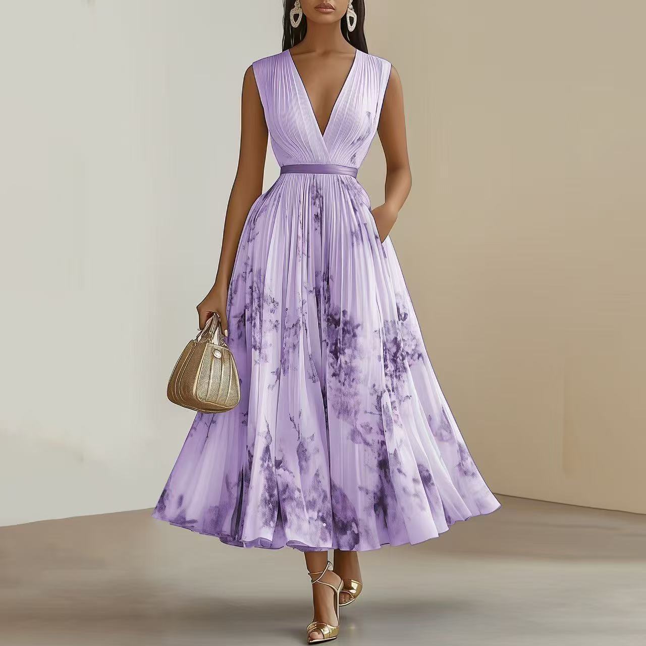 Woman wearing a purple tie-dye dress holding a gold handbag against a neutral background
