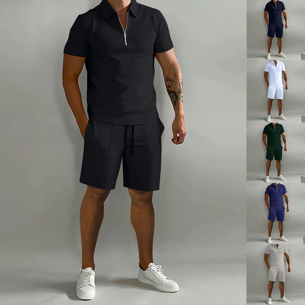 A man modeling a black short-sleeve polo-style swim set with a front zipper and drawstring shorts against a light gray studio background. A vertical strip on the right shows the same swim set in five additional color options: navy, white, white, green, blue, and white.