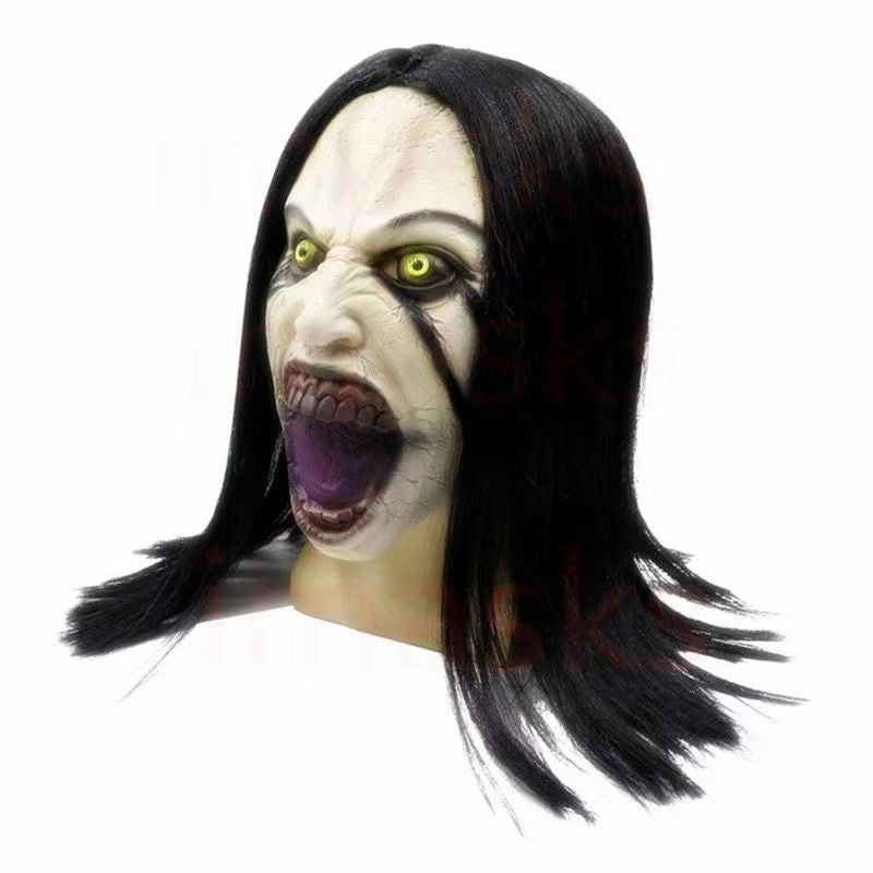 Horror-themed mask with black hair and yellow eyes on a white background