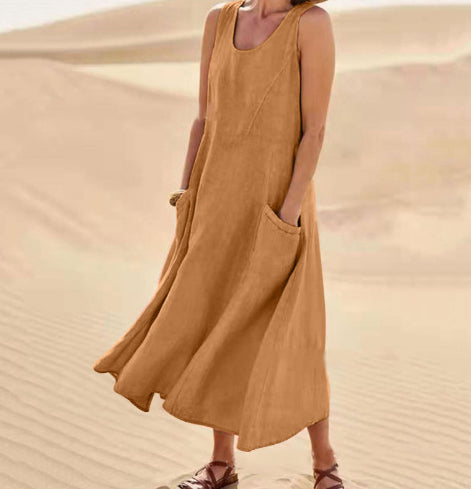 Person wearing a mustard yellow dress standing in a desert setting
