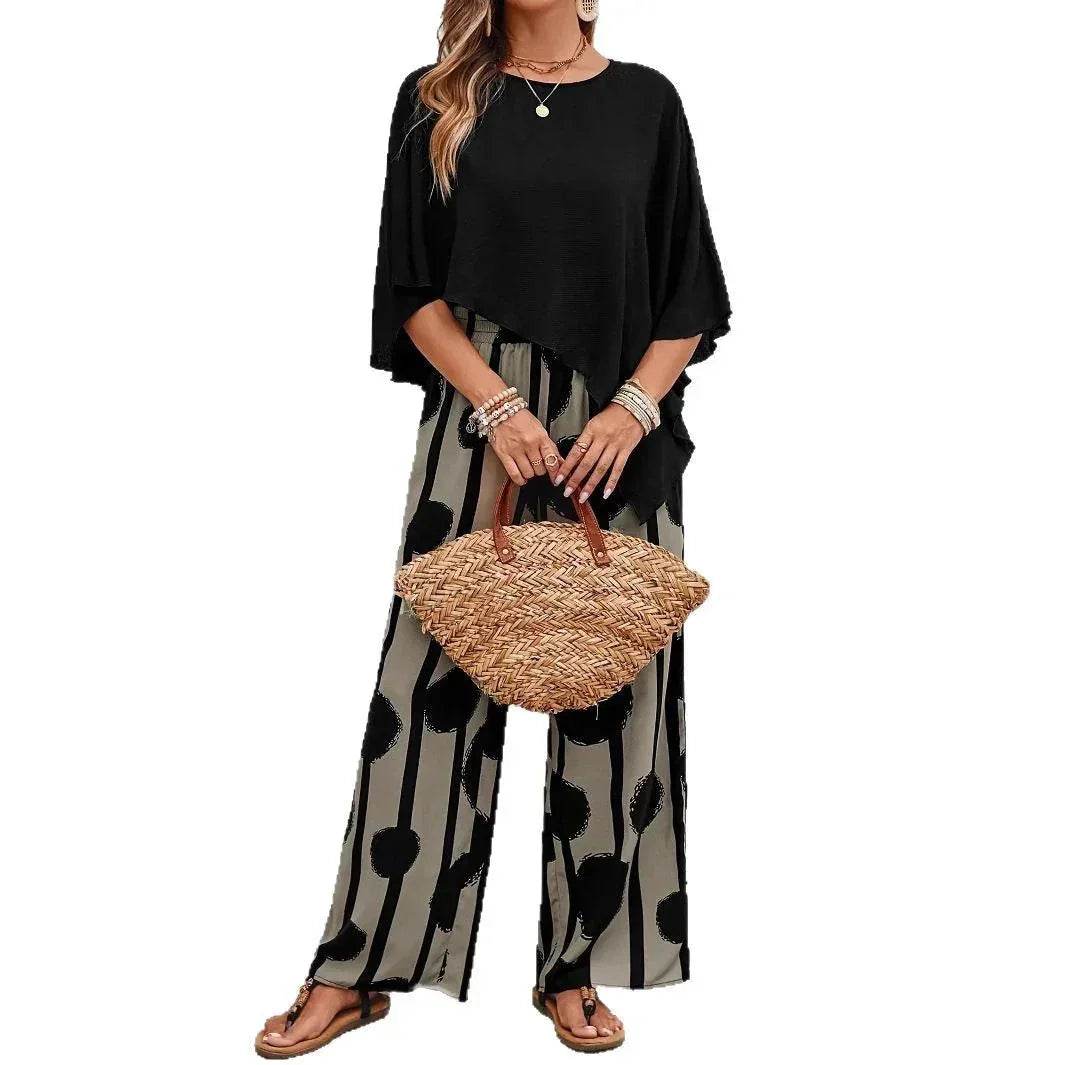 Woman in black top and patterned wide-leg pants holding woven handbag, ZA-Zola fashion