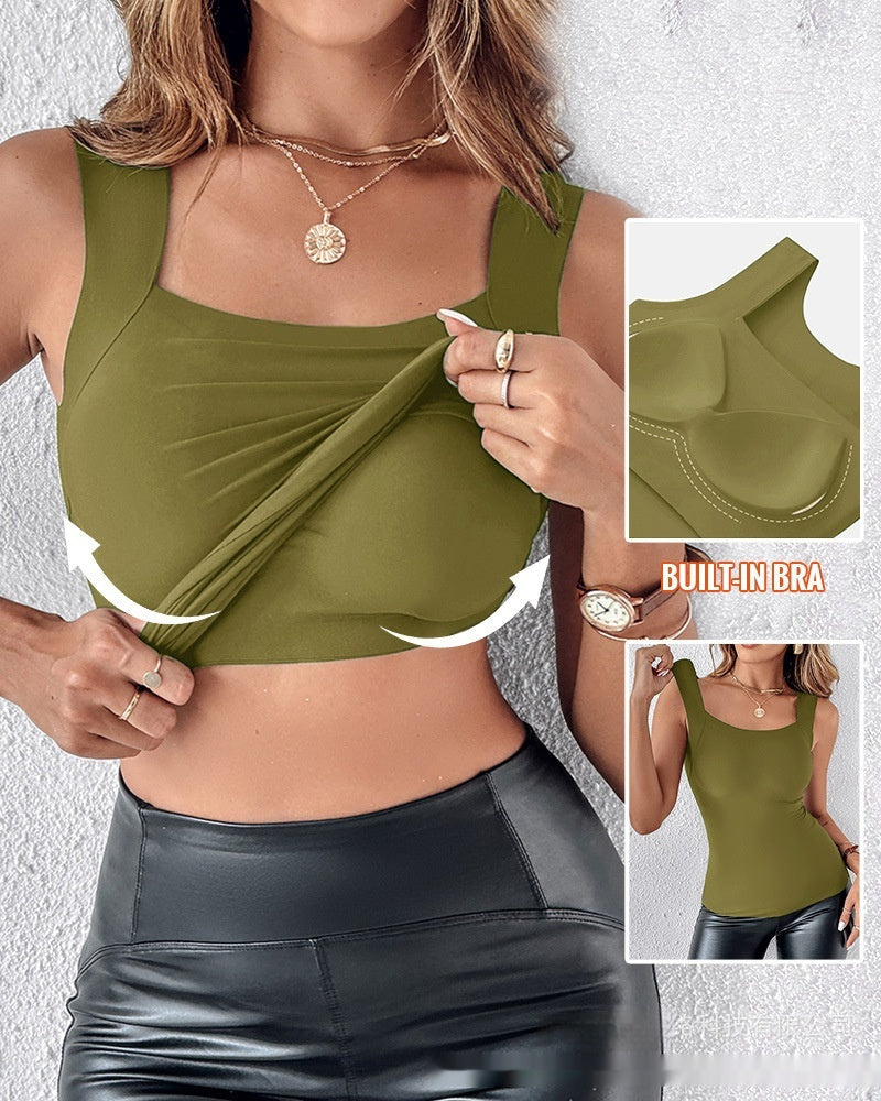 Woman wearing a green sports bra with built-in bra feature highlighted.
