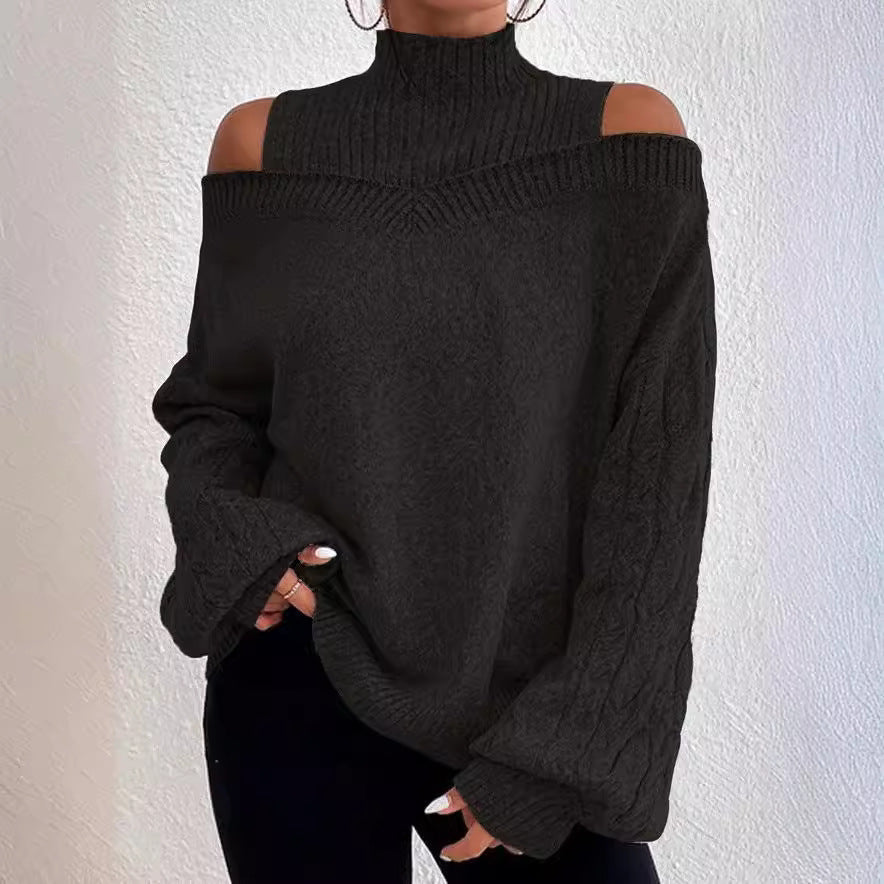 Black off-shoulder sweater worn by a person against a white background