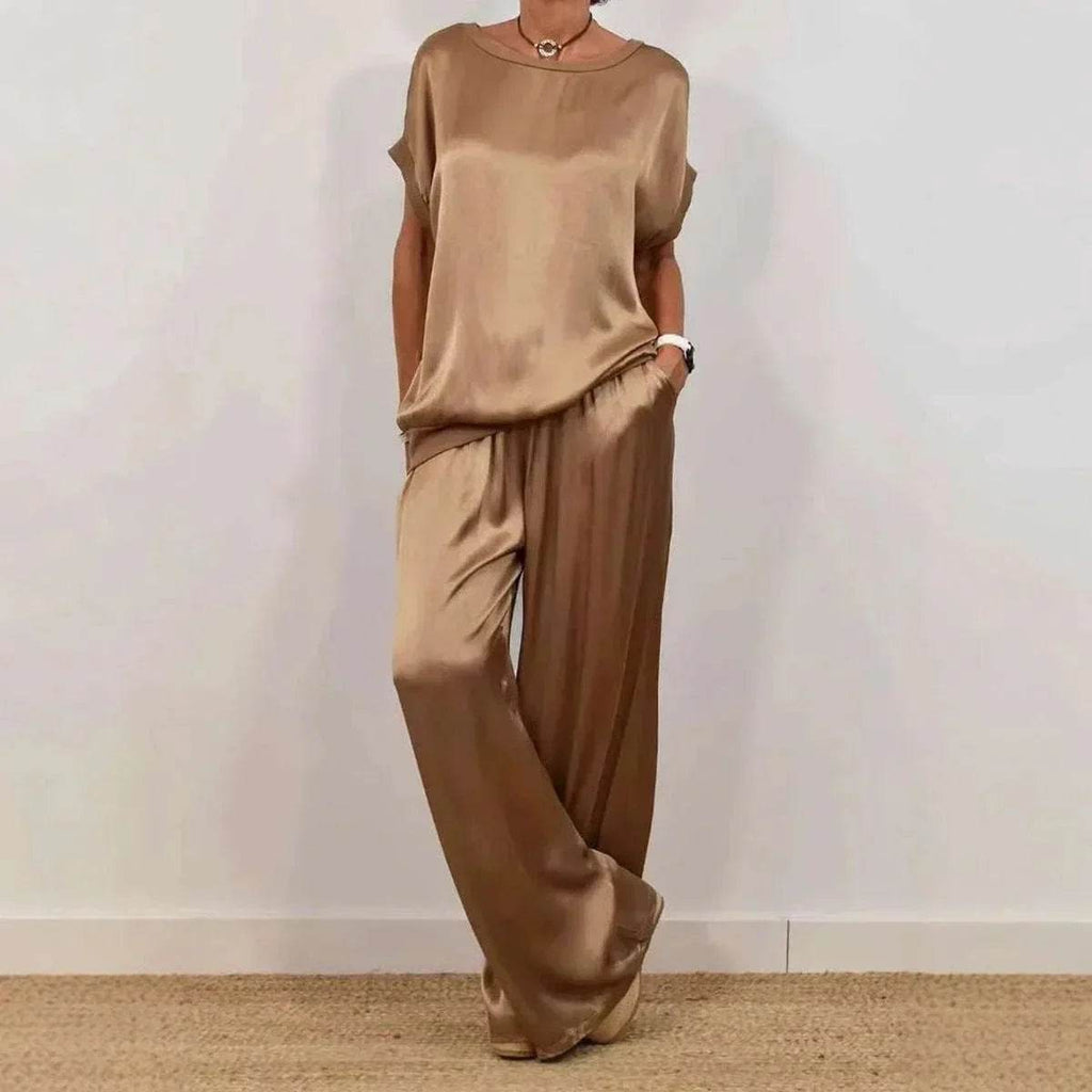 Woman wearing chic satin loungewear set in gold, trendy fashion by ZA-Zola UK