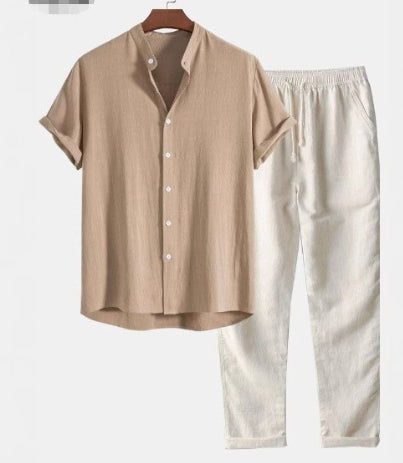 Beige shirt and white pants on a hanger against a white background