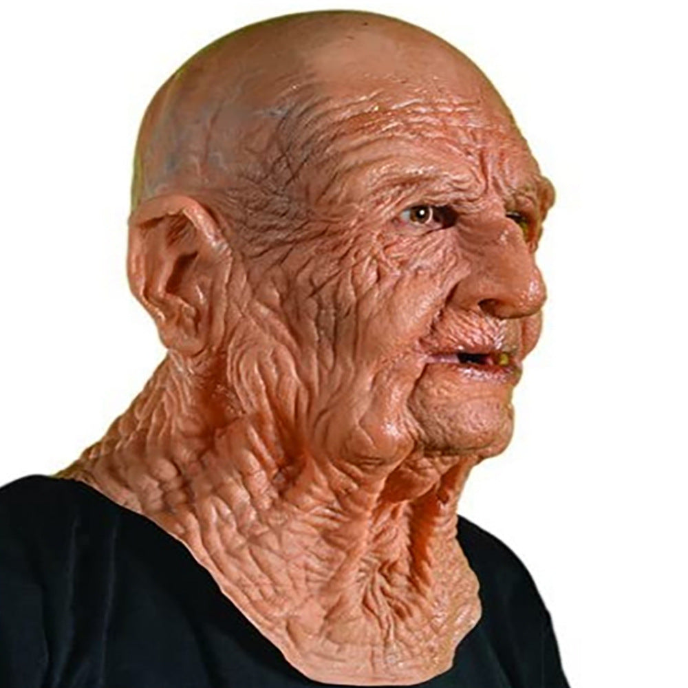 Older man wearing a detailed latex mask with deep wrinkles and a bald head on a white background.