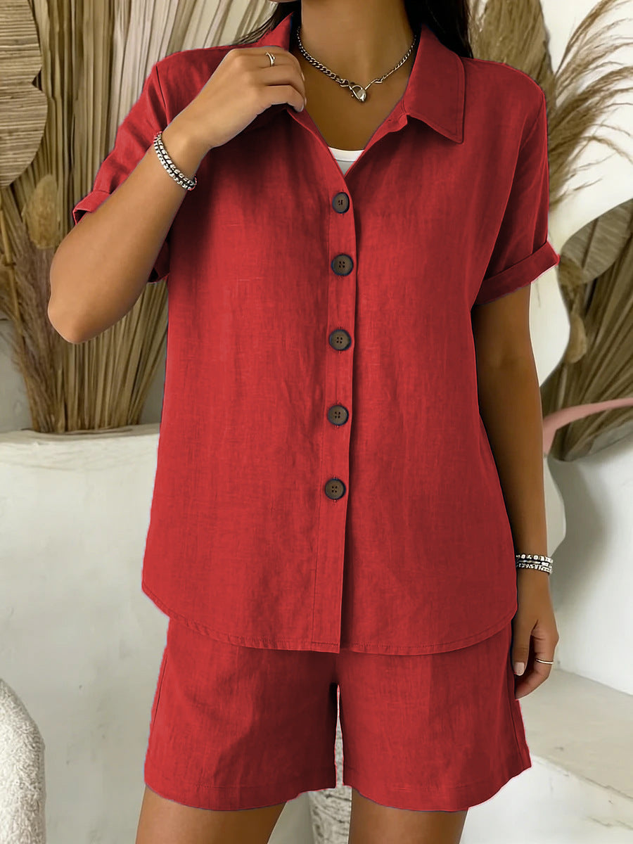 Person wearing a red outfit with buttons in an indoor setting