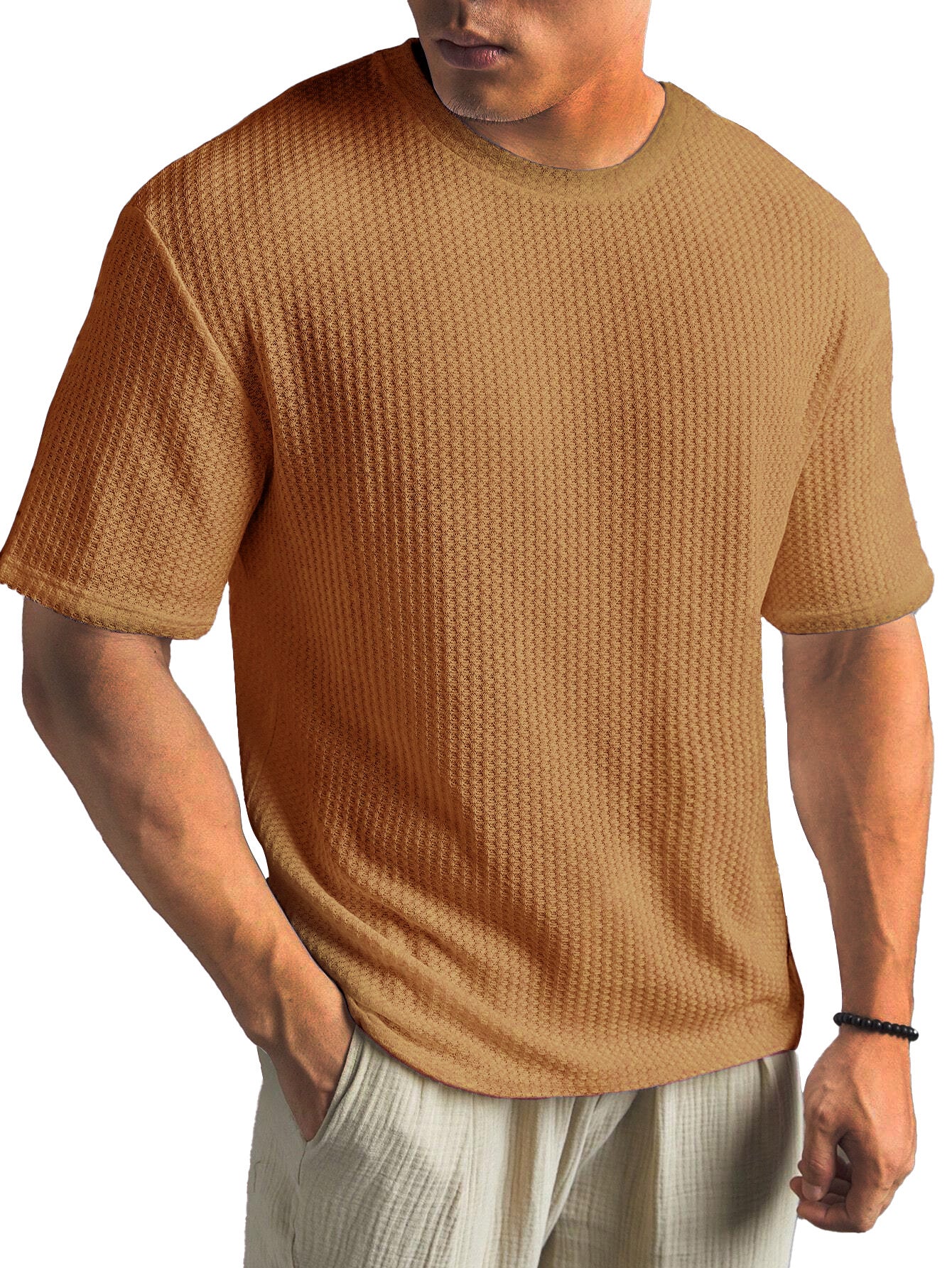 Man wearing a brown textured t-shirt on a white background