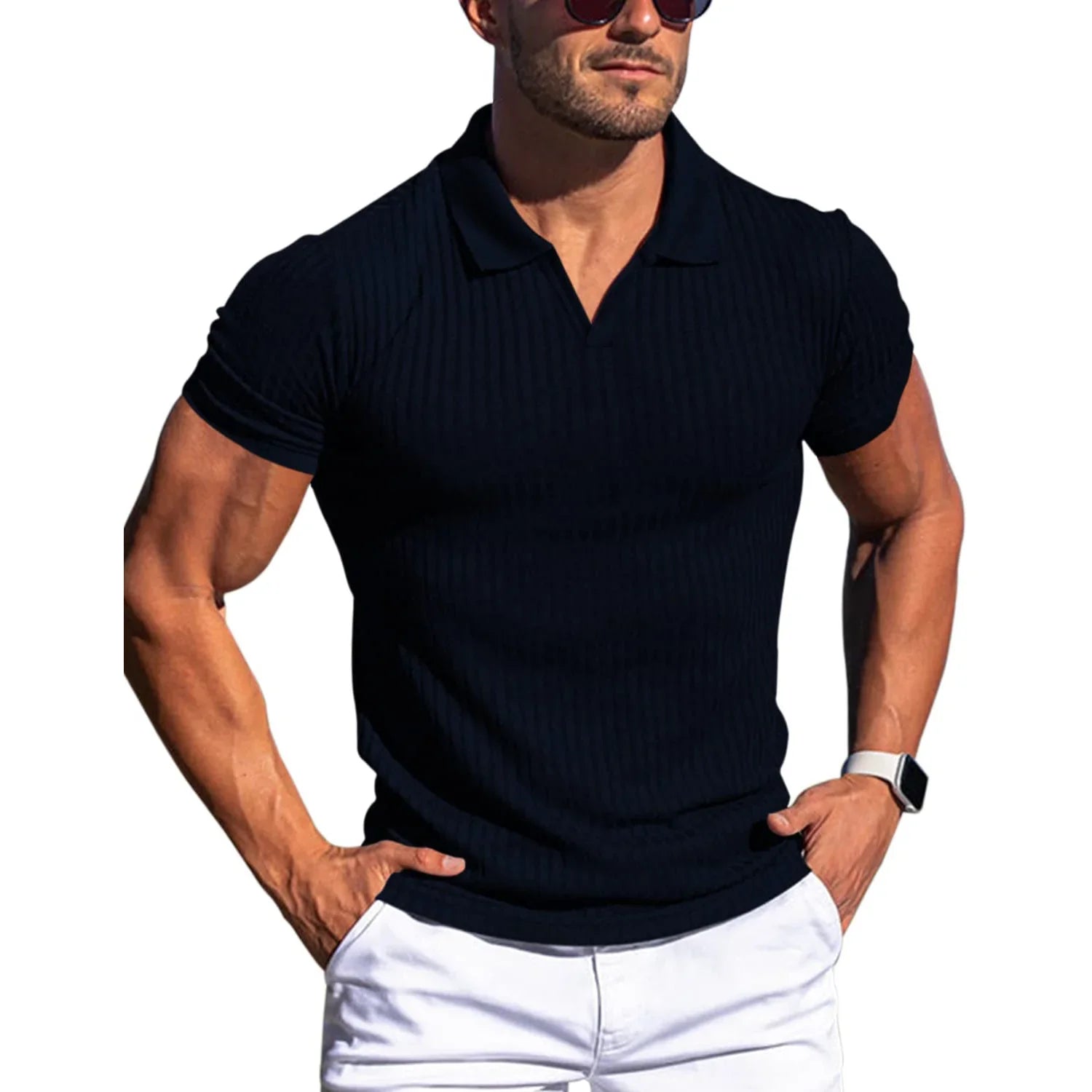 Man wearing a black ribbed polo shirt and white pants on a white background
