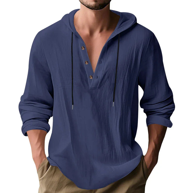 Blue hooded shirt worn by a person on a white background