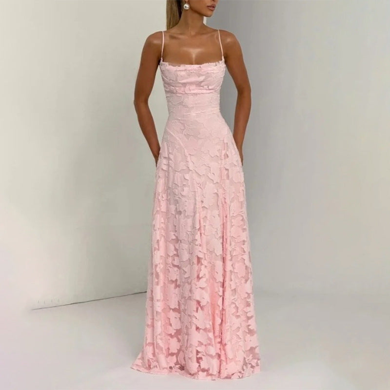 Pink lace dress on a model against a neutral background