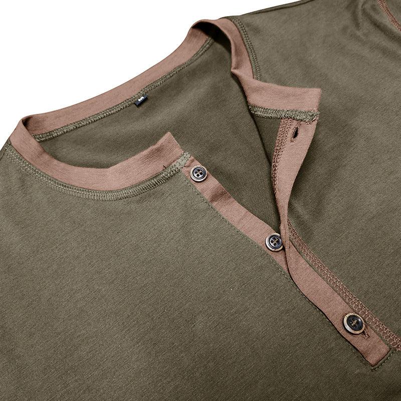 Close-up of a green shirt with brown trim and buttons on a white background
