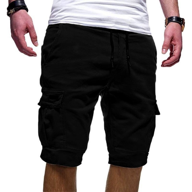 Black cargo shorts worn by a person on a white background