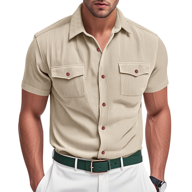 Man wearing a beige short-sleeve shirt with pockets and red buttons on a white background