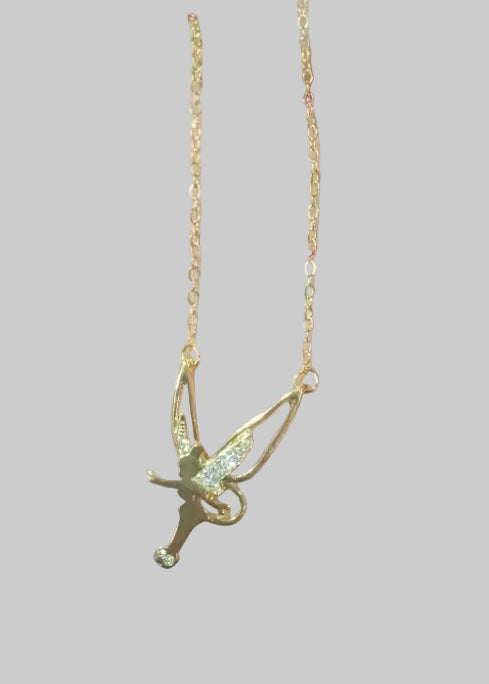 Gold fairy pendant necklace held in a hand with '2PC' text and red arrow pointing to it.
