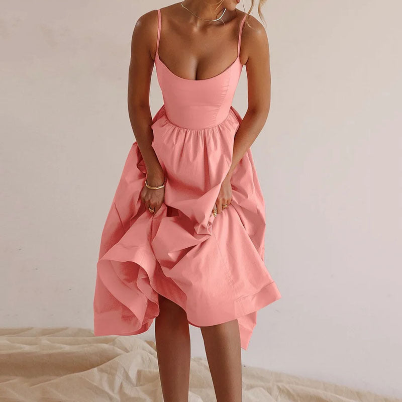 Pink dress worn by a person on a neutral background