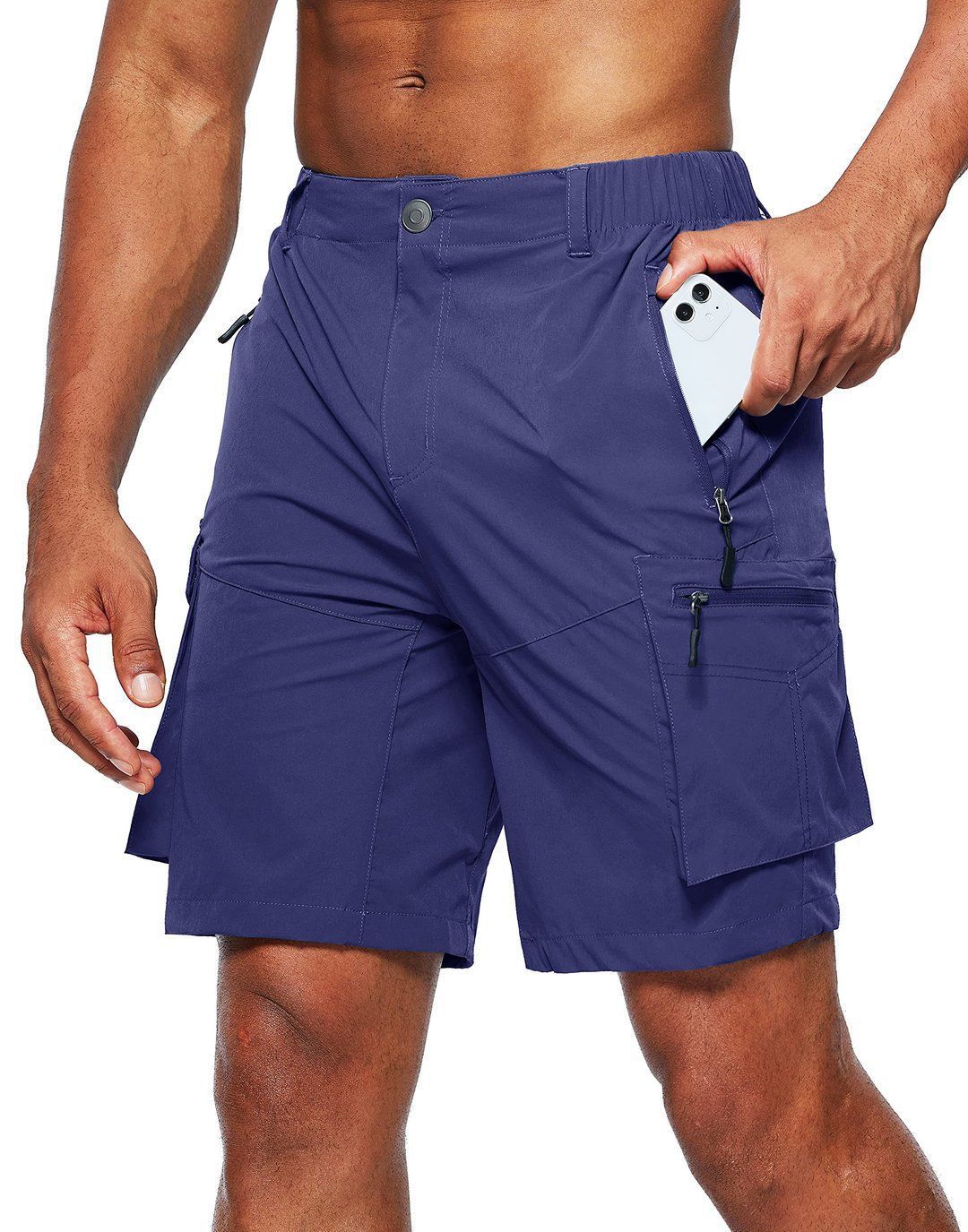 Person wearing blue shorts with multiple pockets on a white background