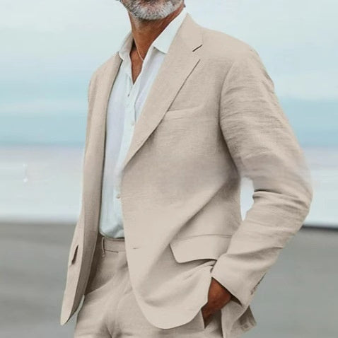 Man wearing a beige suit with a blurred background