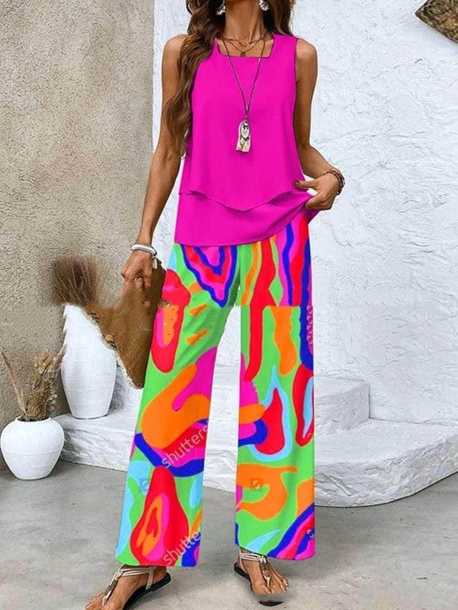 Woman wearing a vibrant pink top and colorful abstract wide-leg pants, ZA-Zola fashion