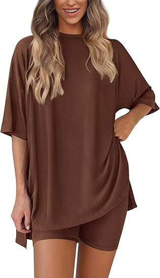 Woman wearing a brown oversized t-shirt and shorts set on a white background
