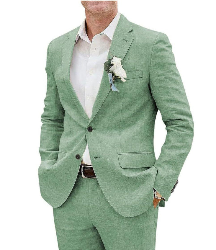 Man wearing a light green suit with a white shirt on a white background