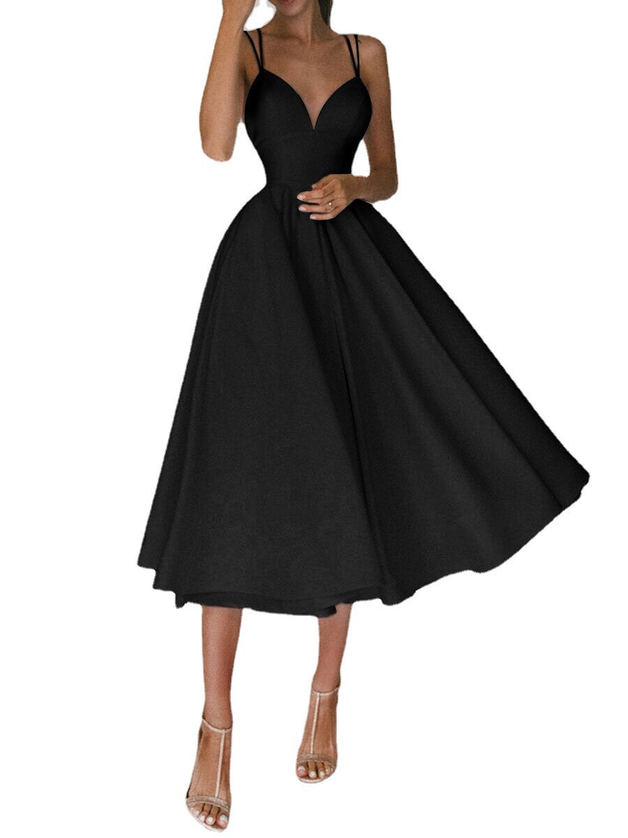 Black dress being twirled on a white background