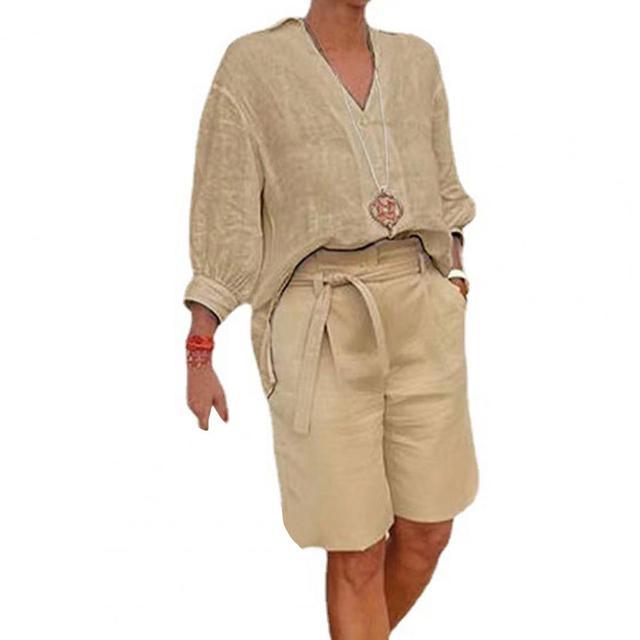 Beige outfit with a top and shorts on a white background