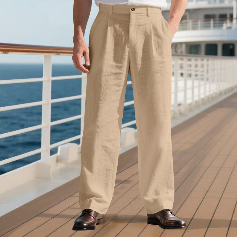 Person wearing beige pants standing on a cruise ship deck with ocean view